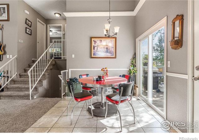 tiled dining space featuring a notable chandelier and ornamental molding