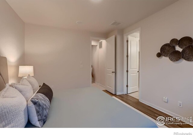 bedroom with light wood-type flooring