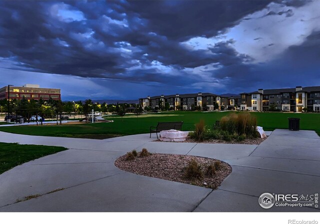 view of property's community featuring a yard