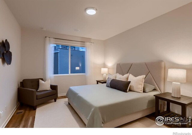 bedroom featuring light hardwood / wood-style floors