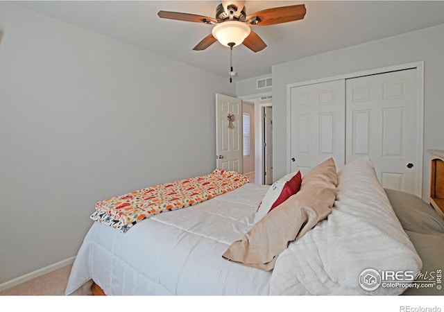 bedroom featuring a closet, ceiling fan, and carpet floors