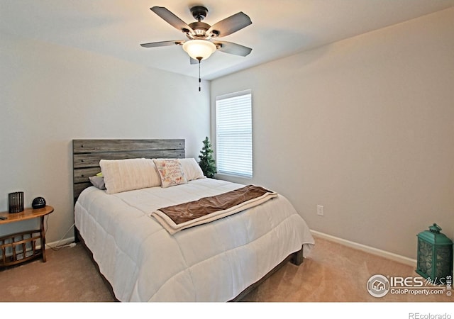 bedroom with light carpet and ceiling fan