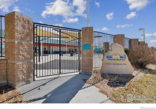 view of gate featuring fence