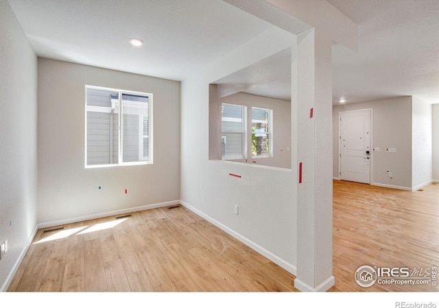 empty room with light wood-type flooring