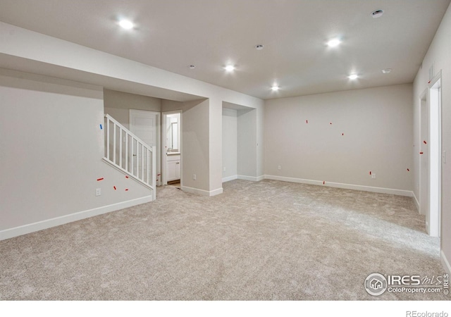 basement with light colored carpet