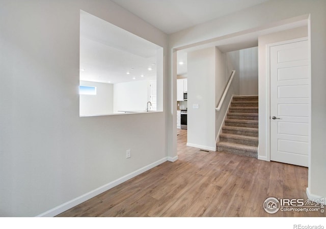 interior space featuring sink and light hardwood / wood-style floors