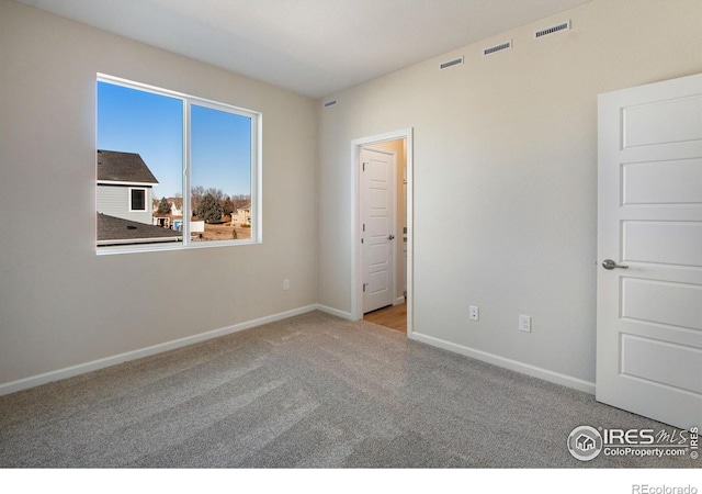 unfurnished bedroom with light colored carpet