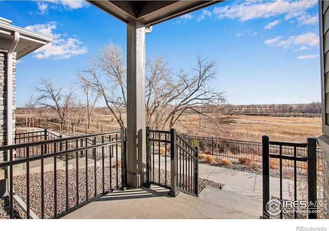 balcony featuring a rural view