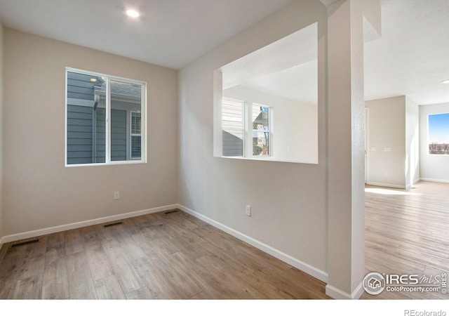 unfurnished room featuring light hardwood / wood-style floors