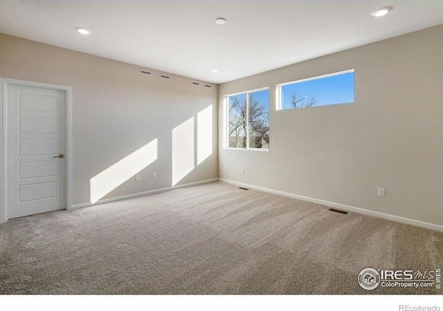 unfurnished room featuring carpet floors