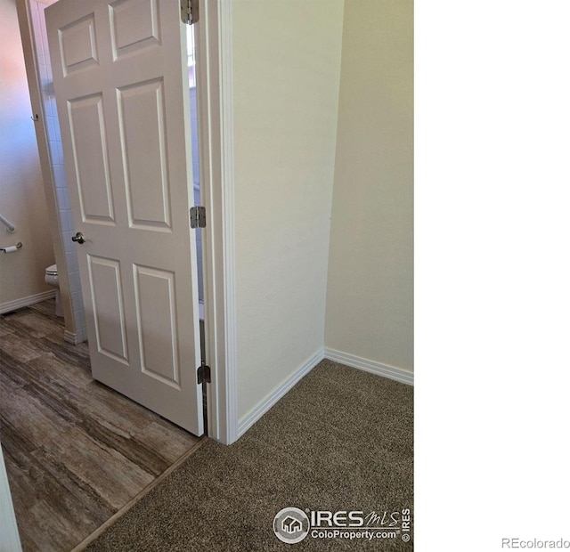 corridor featuring hardwood / wood-style floors