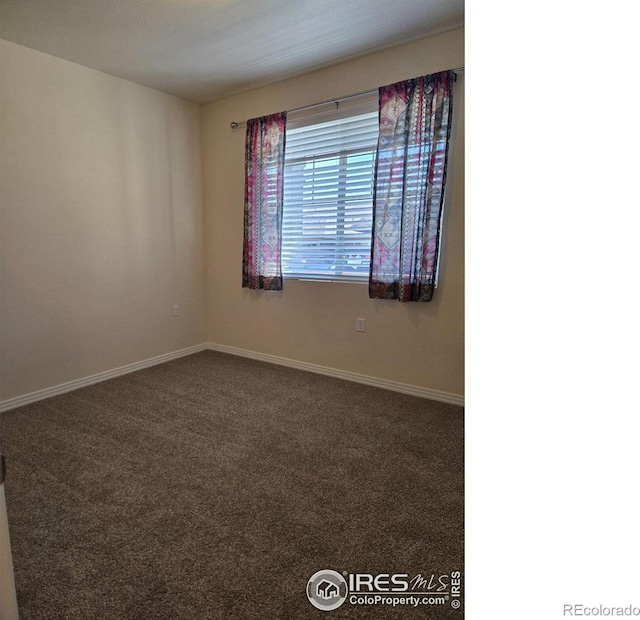 unfurnished room with carpet floors