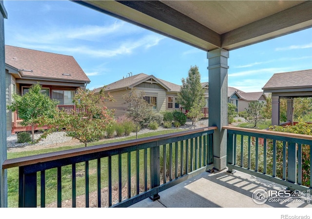 wooden terrace with a yard