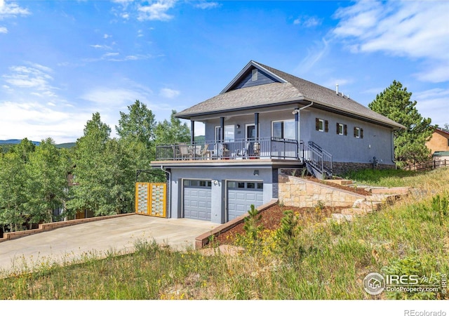 view of front of property with a garage and a porch