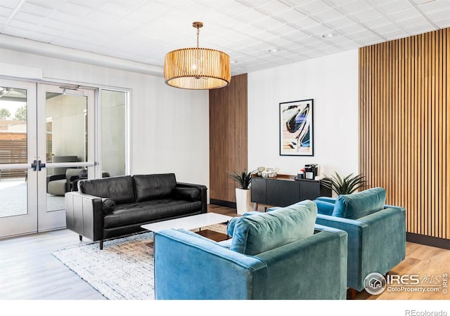 living room with wood-type flooring and french doors