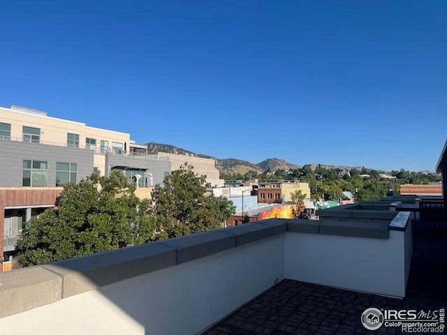 view of patio / terrace featuring a mountain view