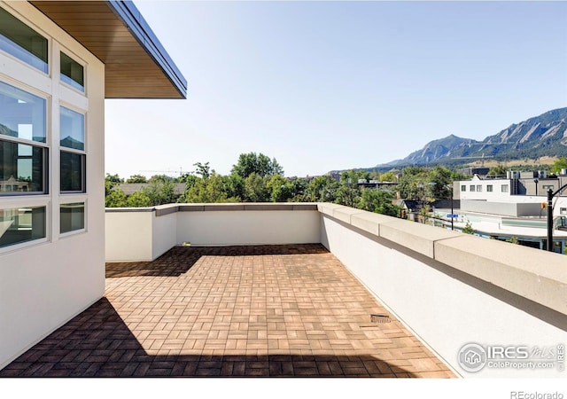 view of patio / terrace featuring a mountain view