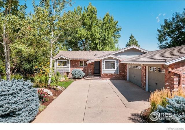 ranch-style house featuring a garage