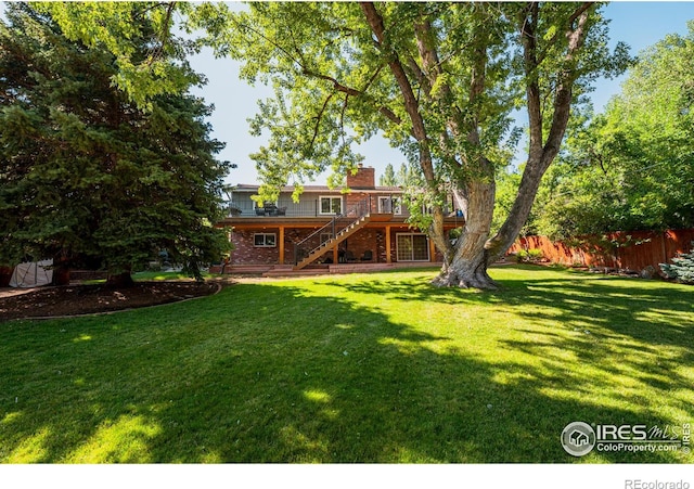 view of yard featuring a wooden deck