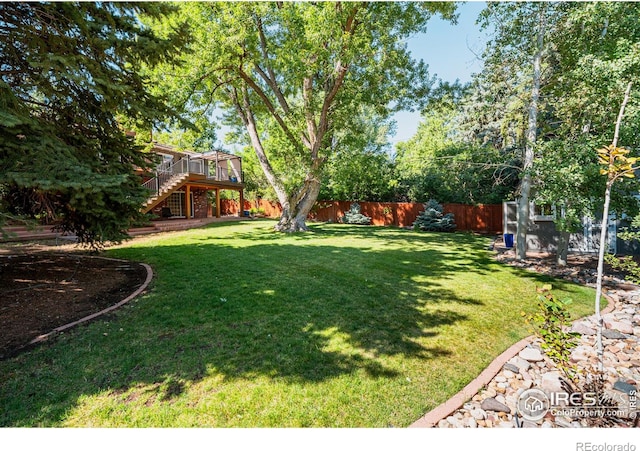 view of yard with a wooden deck