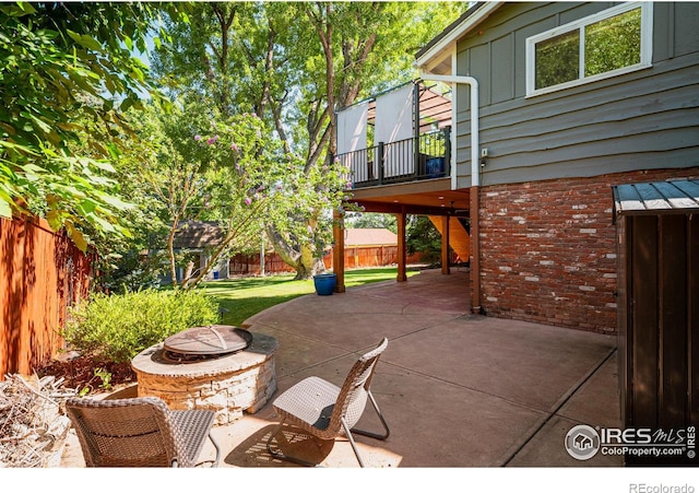 view of patio / terrace featuring an outdoor fire pit