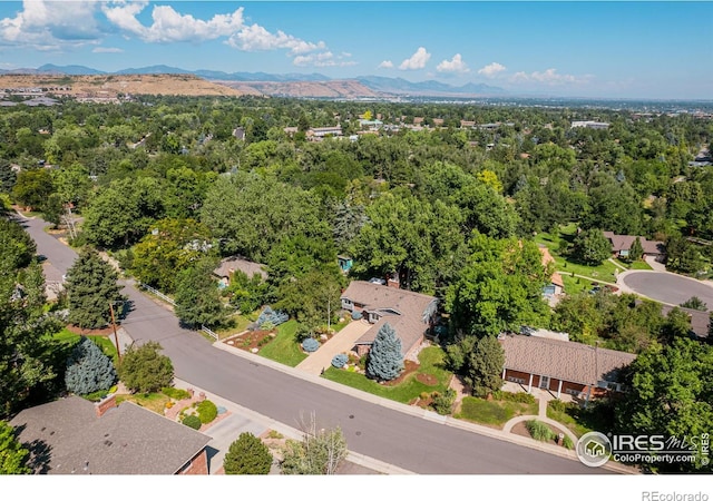 birds eye view of property featuring a mountain view