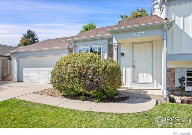 177 S Polk Ave, Louisville, CO 80027 - ranch-style house featuring board and batten siding, a garage, roof with shingles, stone siding, and driveway