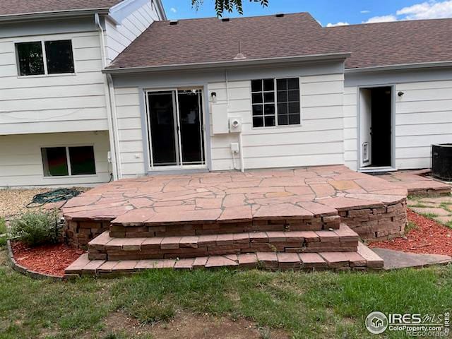 back of property with a patio and central air condition unit