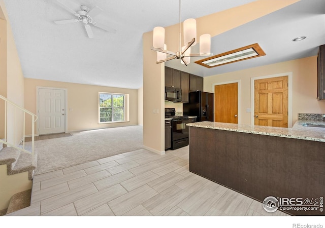 kitchen with light stone counters, pendant lighting, black appliances, dark brown cabinets, and light carpet