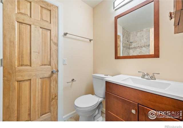 177 S Polk Ave, Louisville, CO 80027 - bathroom featuring vanity, baseboards, and toilet