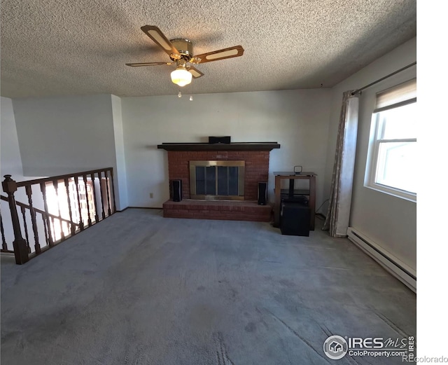 unfurnished living room with a baseboard radiator, a textured ceiling, and a fireplace