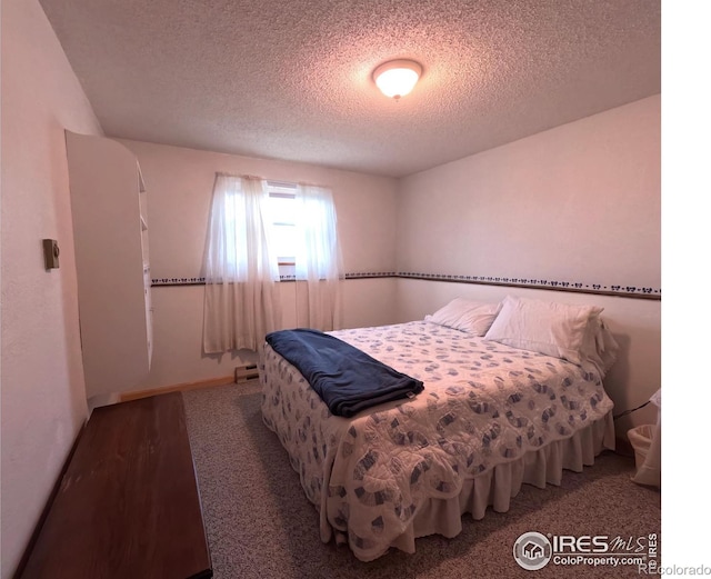 bedroom featuring a textured ceiling