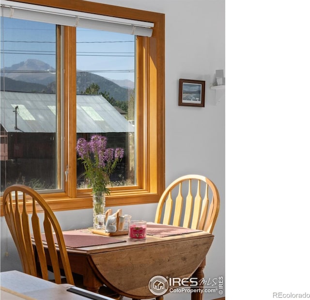 dining space featuring a mountain view