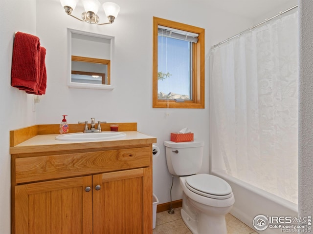 bathroom featuring tile patterned flooring, baseboards, vanity, and toilet