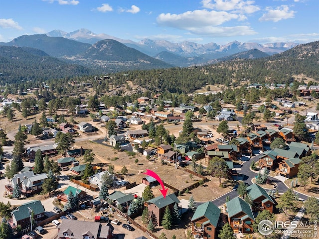 drone / aerial view featuring a mountain view