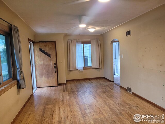 spare room with light hardwood / wood-style flooring