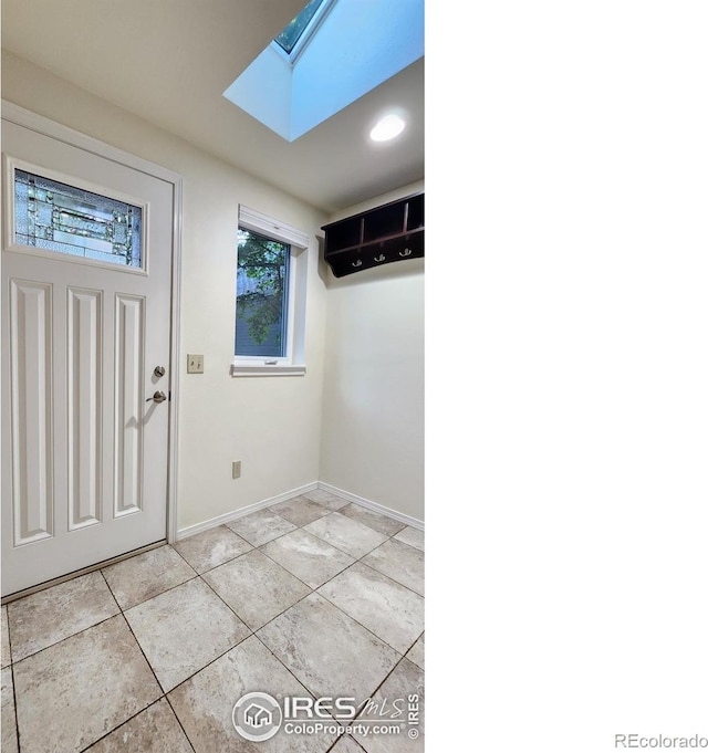 entrance foyer with a skylight