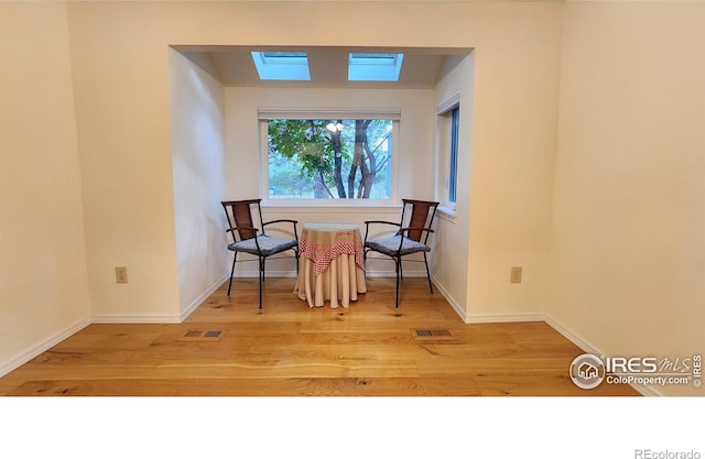 sitting room featuring hardwood / wood-style flooring