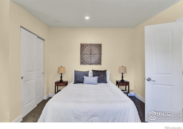 carpeted bedroom featuring a closet