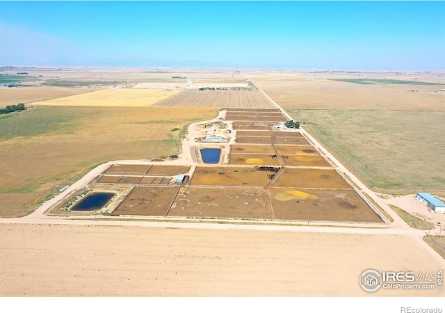 birds eye view of property with a rural view