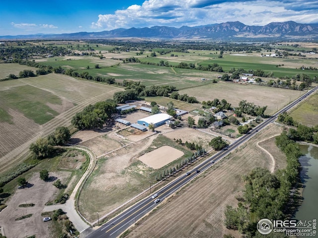 drone / aerial view with a mountain view and a rural view