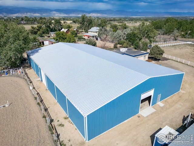 birds eye view of property with a mountain view