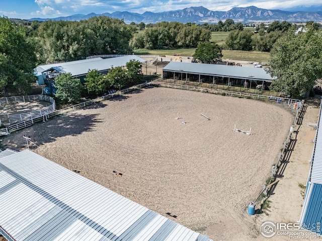 birds eye view of property featuring a mountain view