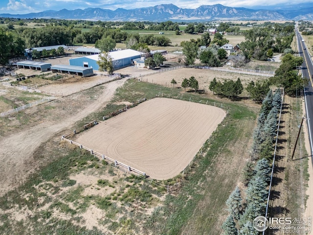 bird's eye view with a mountain view and a rural view