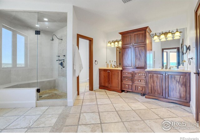 bathroom featuring vanity and a shower with door