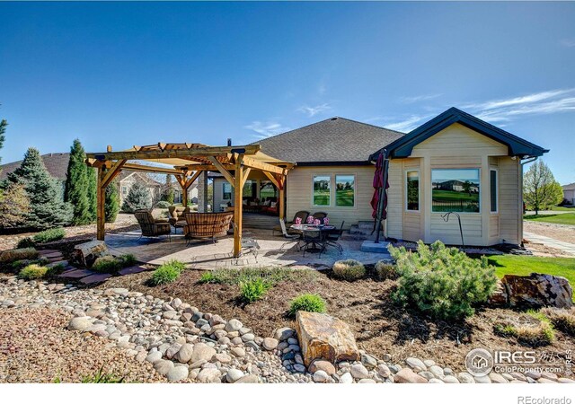 view of front of house featuring a patio area and a pergola