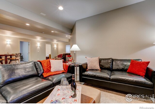 living room featuring light carpet