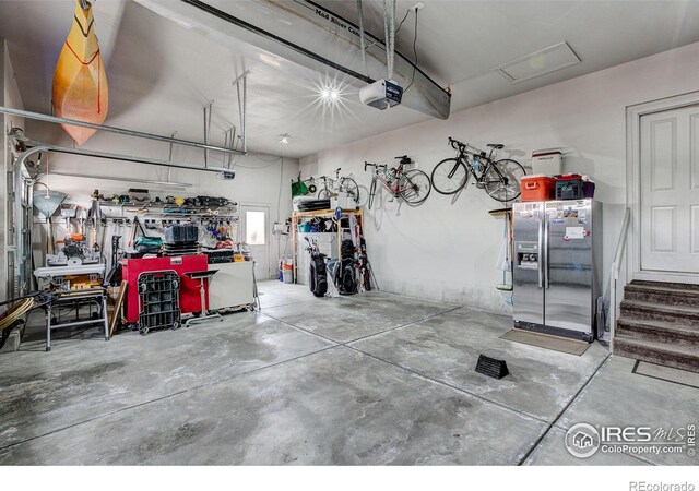 garage featuring a workshop area and a garage door opener