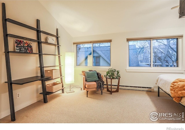 sitting room featuring a baseboard radiator, vaulted ceiling, plenty of natural light, and carpet floors