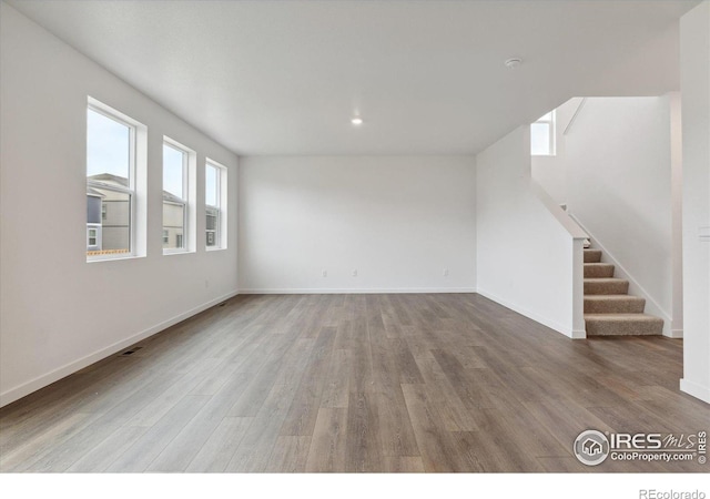 empty room featuring wood-type flooring